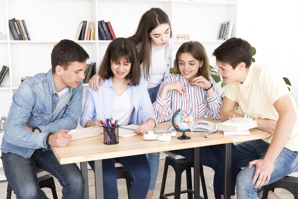 Students studying together library